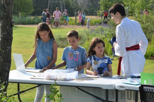 Kids working on their invasive hunter action dioramas