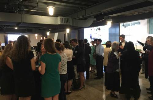 Attendees networking at the UT ESI dinner.